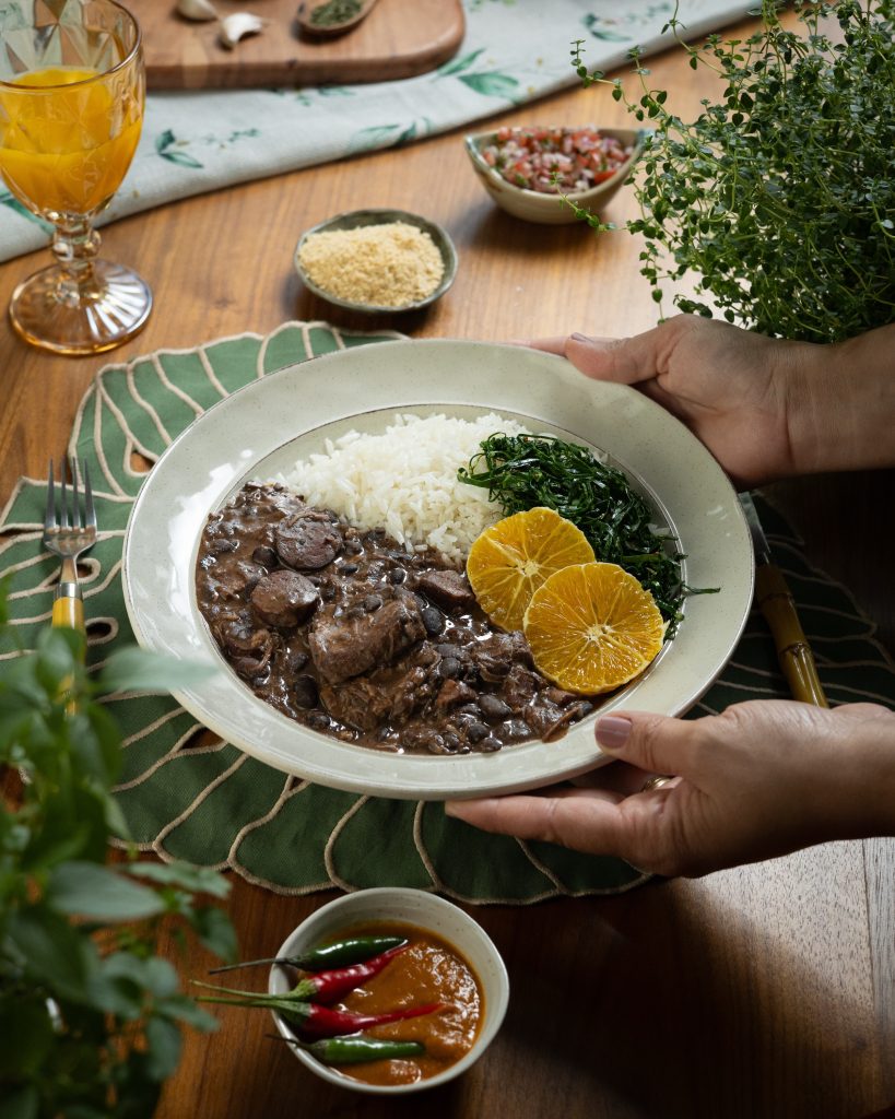Feijoada da Travessia: black bean stew with pork and beef, white rice, collard greens, orange slices, farofa and vinaigrette
